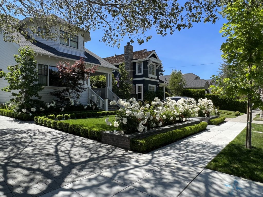 a photo of a white single family home with a nice landscaping in Burlingame Park