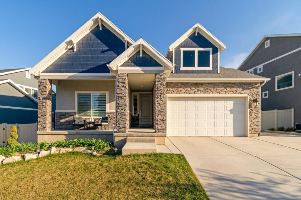 white and brown concrete house under blue sky.
